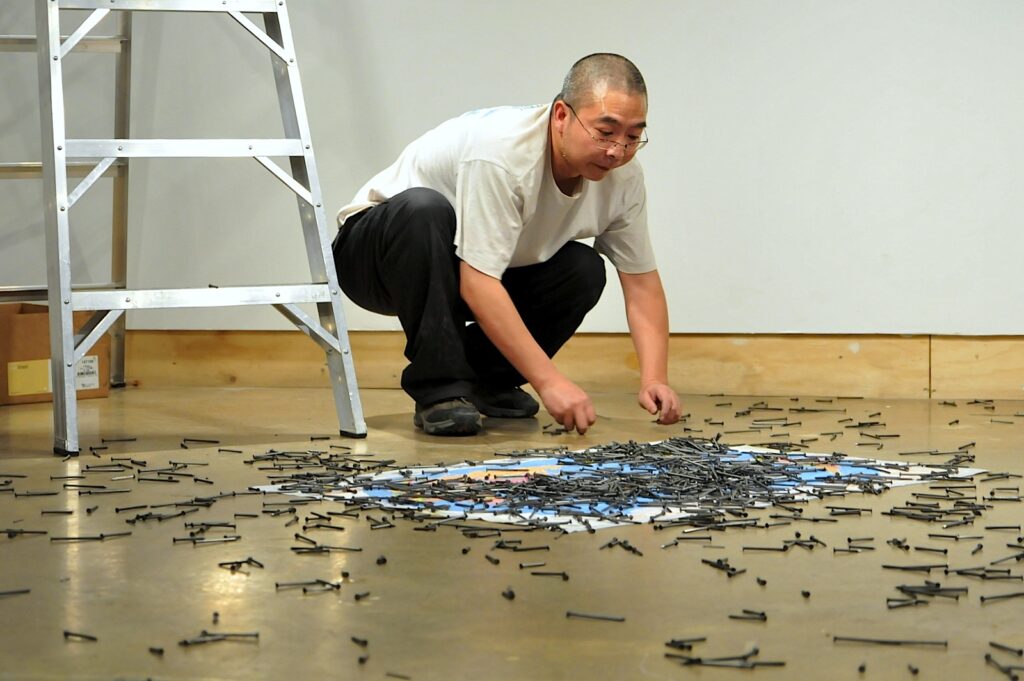 Chen Jin performing ‘Point at the world’ at XPACE.