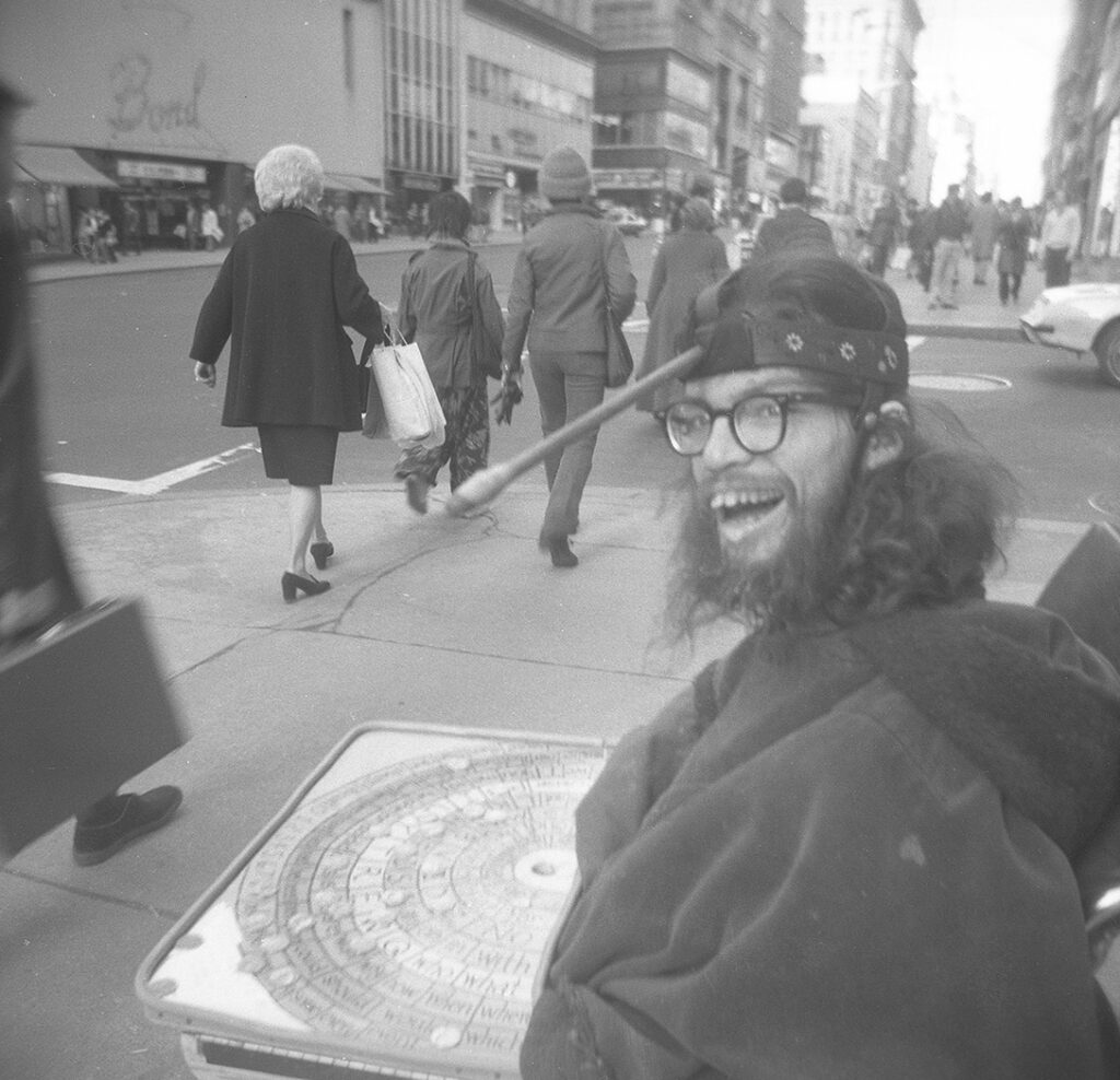 Frank Moore panhandling in front of Altman’s department store, New York, USA early 1970s