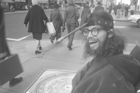 Frank Moore panhandling in front of Altman’s department store, New York, USA early 1970s