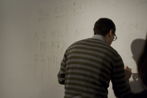 Julian Higuerey Núñez performng the conditions of surrender at XPACE Cultural Centre