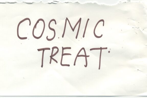 Notebook page from Step 2 with the words 'Cosmic treat' in thick black marker