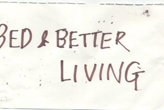 Notebook page from Step 2 with the words 'Bed and better living' in thick black marker
