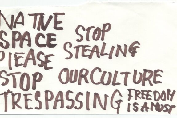 Notebook page from Step 2 with the words 'Natve space pleas stop trespassing stop stealing our culture freedom is a must' in thick black marker