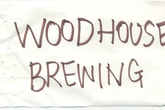 Notebook page from Step 2 with the words 'Woodhouse Brewing' in thick black marker
