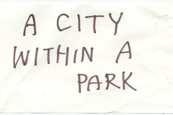 Notebook page from Step 2 with the words 'A city within a park' in thick black marker