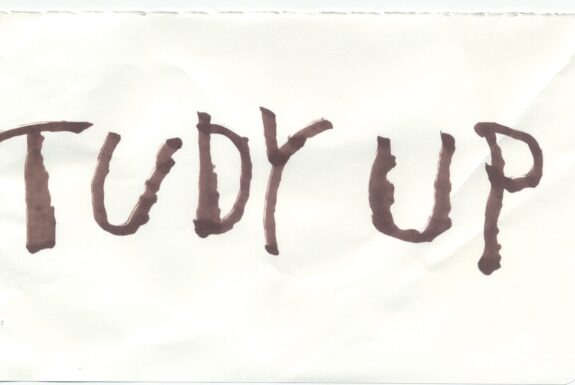 Notebook page from Step 2 with the words 'Tudy up' in thick black marker